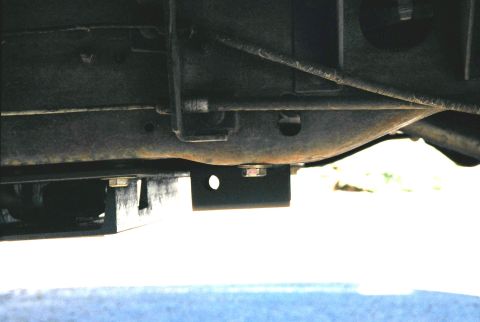 1996 Ford Bronco - Side view of shackle mount. The front hole in the mount is where the shackle will bolt in. The top of the 2x2 was cut back to allow the sha…