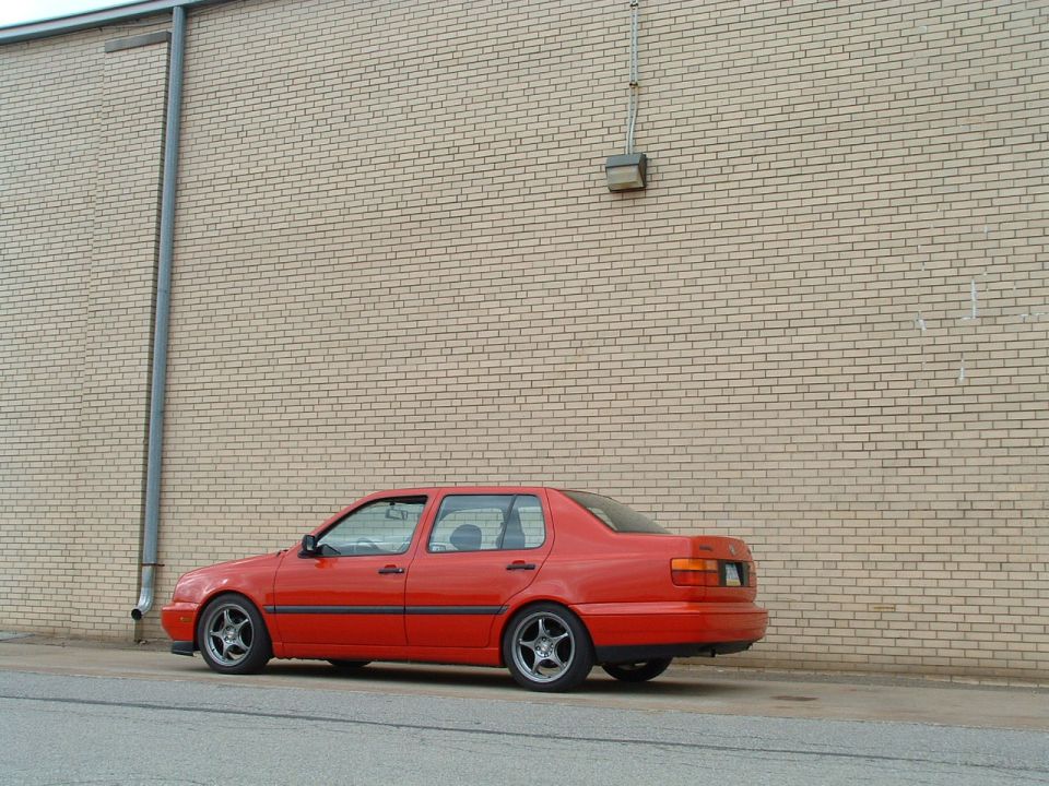 Red 1994 Volkswagen Jetta sedan, side view