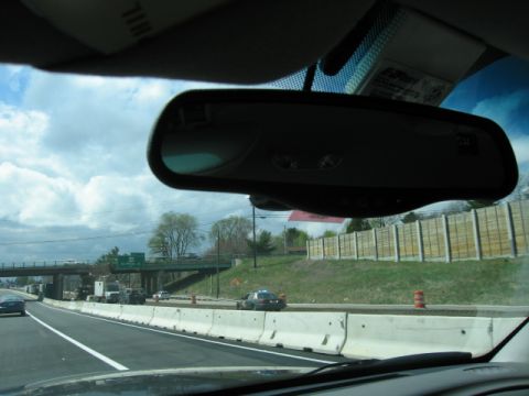 1991 Ford LTD Crown Victoria - Driving on the highway with other vehicles and a sound barrier visible.
