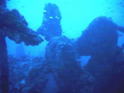 1988 Ford Bronco - Submerged debris and coral formations are visible in this underwater scene.
