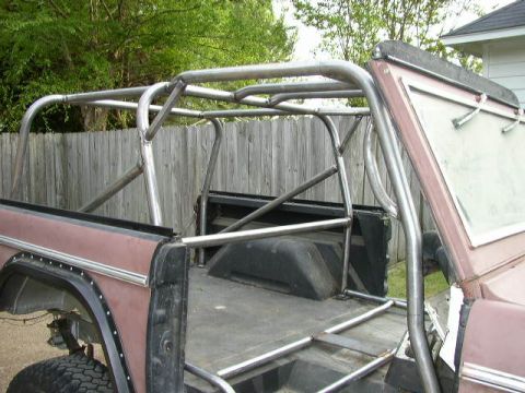 1995 Ford Bronco - This Ford Bronco features a custom roll cage installed in the rear bed.