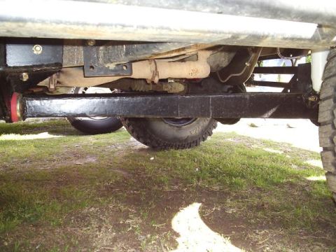 1994 Ford Bronco - This photo shows the heavy-duty suspension and exhaust system of a modified off-road vehicle.
