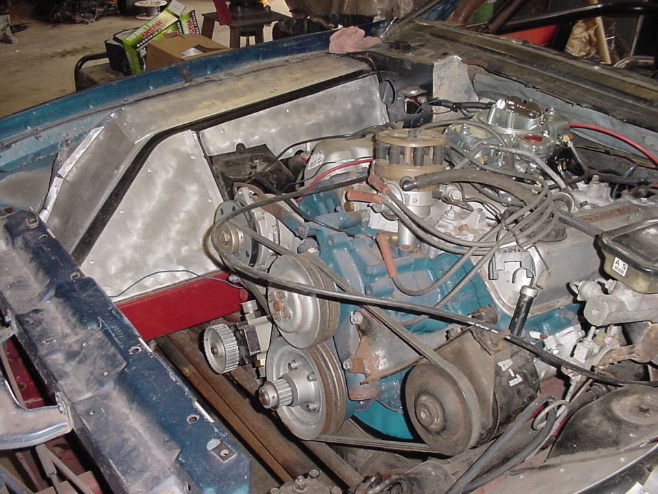 Engine bay with V8 engine, carburetor, and distributor