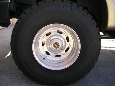 1999 Ford F-150 - A close-up view of a custom Weld wheel and tire on a vehicle.