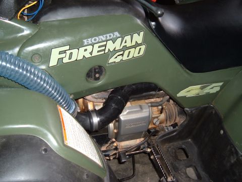 1978 Ford Bronco - Close-up view of the engine area and bodywork on a Honda Foreman 400 ATV.