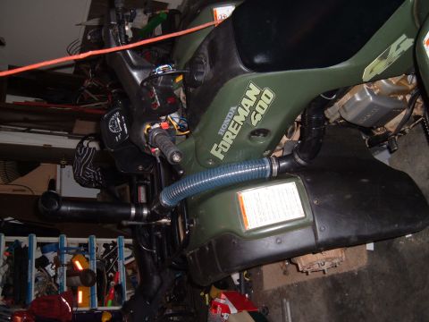 1978 Ford Bronco - This Honda Foreman 500 ATV is shown in a garage setting, with various tools and equipment in the background.