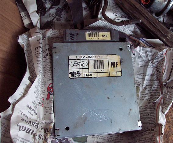 Ford EEC-IV engine control unit with labels E53F-12A650-F1B and EEC-IV CFI-SD1