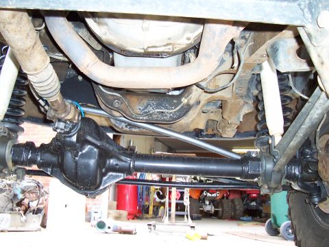 1994 Ford F-150 - The photo shows the underside of a vehicle, focusing on the rear axle and suspension system.