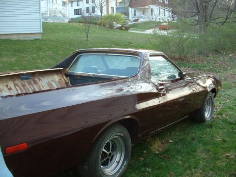 1972 Ford Ranchero - This 1972 Ford Ranchero pickup truck is seen from the rear quarter angle, showing its brown paint and utility bed.