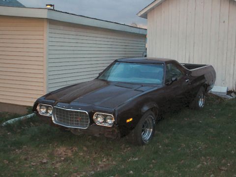 1972 Ford Ranchero - This 1972 Ford Ranchero is parked in front of a building on a cloudy day.