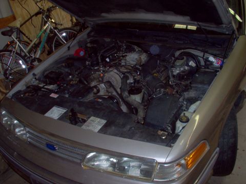 1994 Ford Crown Victoria - After rewiring the blinkers to the old outboard positions, soldering on the old headlight connectors, & moving the hood latch, the bumper w…