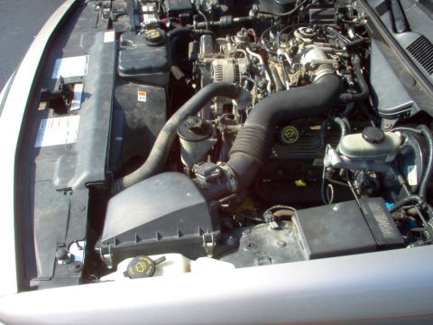 1994 Ford Crown Victoria - Close-up view of the engine bay, showing various components and hoses.