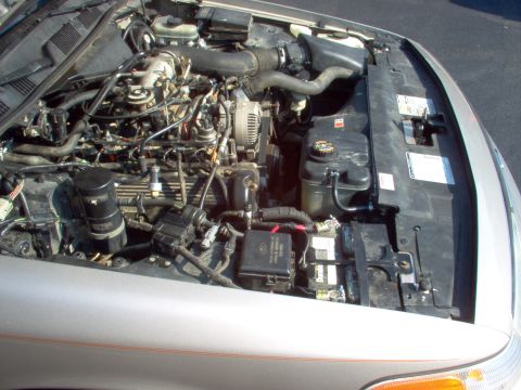 1994 Ford Crown Victoria - If you didn't know it was the wrong engine, it'd be hard to notice. Note the soldered-on battery terminals. They're the best replacements.
