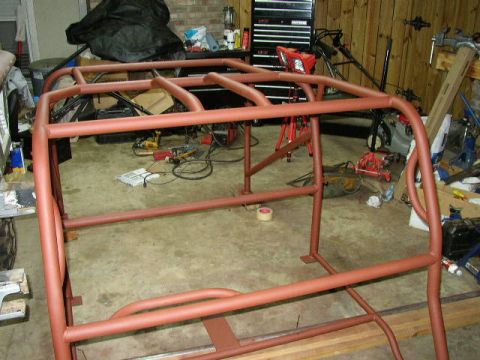 1995 Ford Bronco - A custom roll cage, likely for an off-road vehicle, is shown in a workshop environment.
