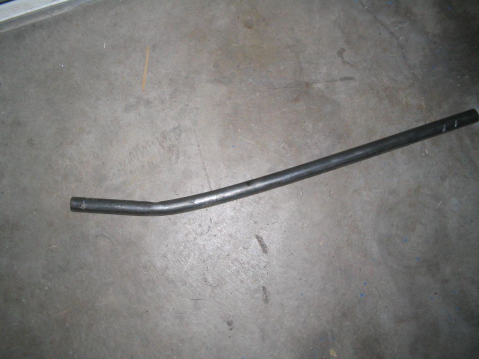 Bent metal pipe on concrete floor