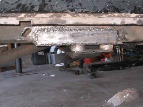 1991 Ford Bronco - Vehicle frame repair shows extensive welding work on the chassis.