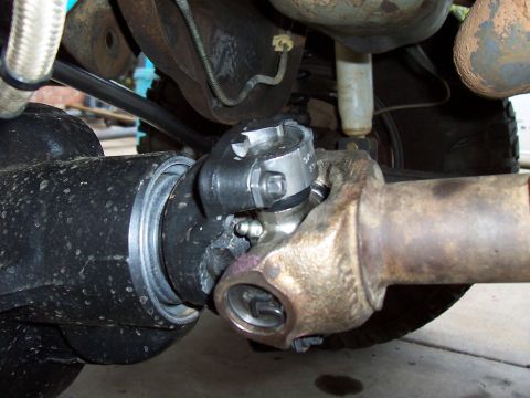 1994 Ford F-150 - This image shows a close-up view of a vehicle's driveshaft and U-joint assembly.