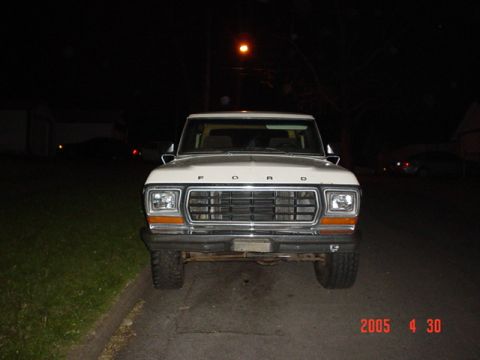 1979 Ford Bronco - This 1979 Ford Bronco is shown head-on at night, with its grille and headlights illuminated.
