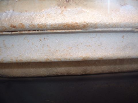 1978 Ford Mustang II - Close-up of a rusted metal frame section, likely from a vehicle's undercarriage.
