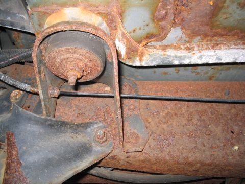 1979 Ford Bronco - Close-up view of heavily corroded undercarriage components, showing significant rust damage.
