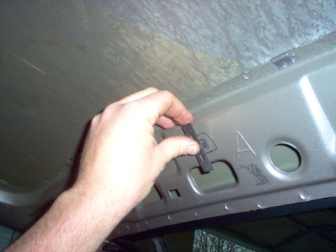 1994 Ford Crown Victoria - The later grab handle screw clips won't fit into the holes pre-punched into my '94 roof.