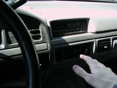 1994 Ford Bronco - Interior view of a 1994 Ford Bronco, focusing on the dashboard and controls.
