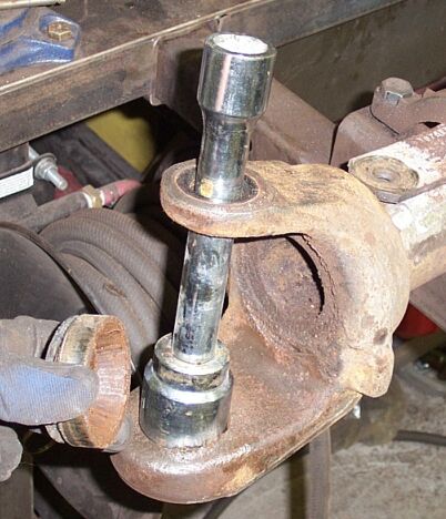 1986 Ford Ranger - Once the upper spindles were out I used a large socket and extension to pound out the lower cap and race
