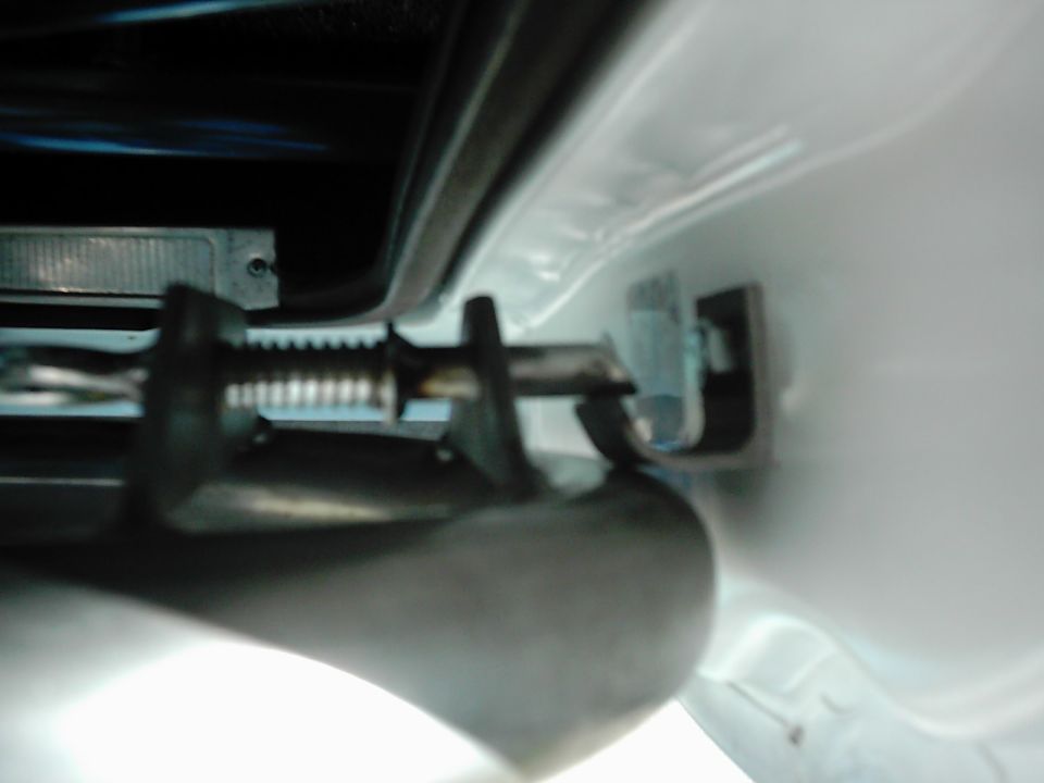 1978 Ford Bronco door latch mechanism, white exterior, close-up view