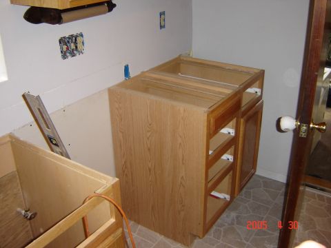 1993 Ford Bronco - The photo shows unfinished kitchen cabinets and exposed electrical outlets during a renovation project.