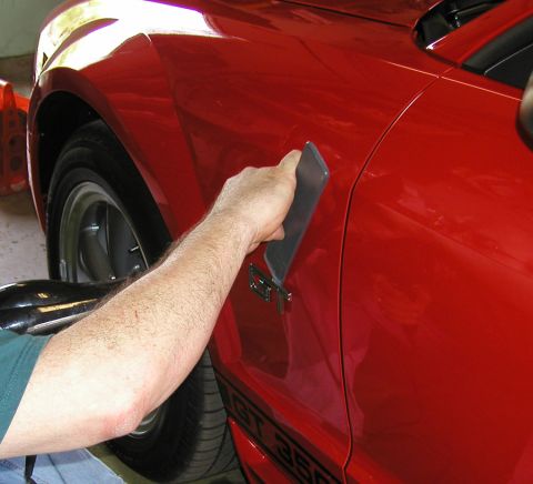 2005 Ford Mustang - Detailing the fender of a red 2005 Ford Mustang GT 350.
