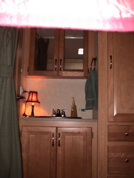 2004 Ford Excursion - Bathroom sink in the kids bunkhouse area. Toilet room is to the left