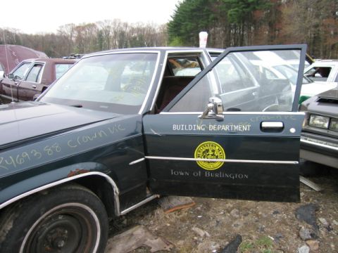 1991 Ford LTD Crown Victoria - Dark green sedan with "BUILDING DEPARTMENT" and "Town of Burlington" text on the door.
