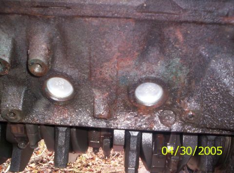 1985 Ford Bronco - This image shows a close-up of an engine block, revealing the crankshaft and frost plugs, with a date stamp from 2005.