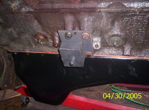 1985 Ford Bronco - Close-up view of an engine block and oil pan, with a motor mount visible.