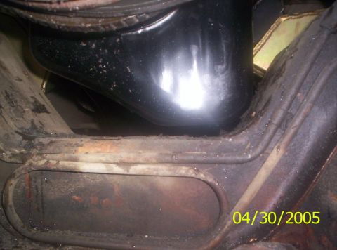 1985 Ford Bronco - Undercarriage view shows a black component and rusty metal framing, dated 04/30/2005.