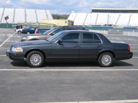 1991 Ford LTD Crown Victoria - Side view of a 1991 Ford Crown Victoria LTD in a parking lot.