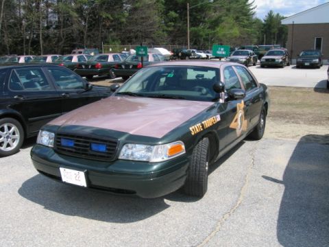 1991 Ford LTD Crown Victoria - A Ford Crown Victoria Police Interceptor is parked in a lot with other vehicles visible.