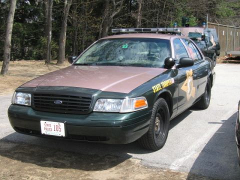 1991 Ford LTD Crown Victoria - State Police Crown Victoria parked with another vehicle visible in the background.