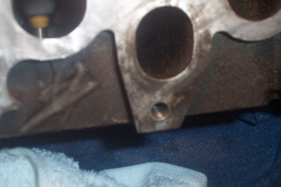 Close-up of an engine cylinder head with intake/exhaust ports visible