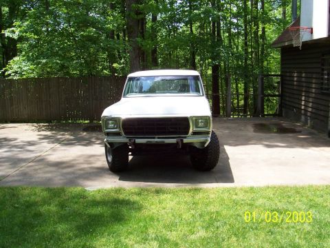 1979 Ford Bronco - This 1979 Ford Bronco is shown from the front, a black grille and prominent tires.