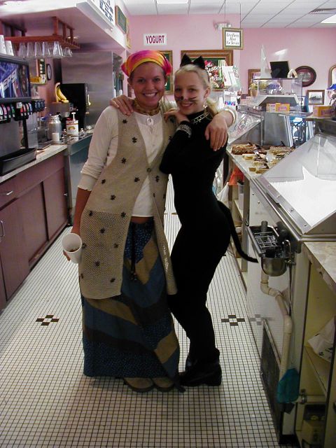 1997 Ford Taurus - Two women pose for a photo inside a yogurt shop, one dressed as a cat.