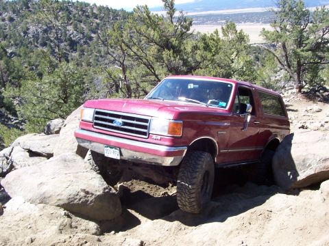 1991 Ford Bronco - This 1991 Ford Bronco navigates a rocky, off-road path with steep inclines.