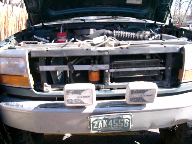 Origianal setup about to be removed due to hole in tranny cooler.  Note oil filter setup.  The hot fluid from the tranny goes into the oil filter first, then to the bottom of the cooler and back to the tranny.  The oil filter assembly removes a ton of heat as well as junk.