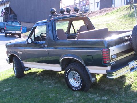 1992 Ford Bronco - This 1992 Ford Bronco features a roof rack with four auxiliary lights and a spare tire mounted on the rear.