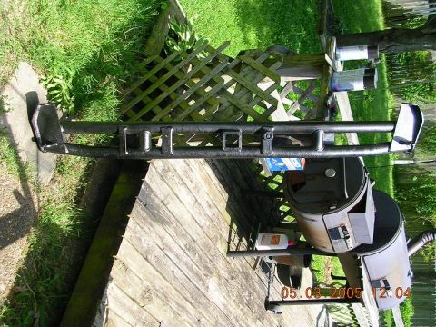 1989 Ford Bronco II - This is a close-up of an aftermarket rear bumper with a hitch receiver, placed on a wooden deck.