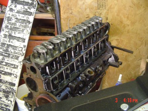 1985 Ford Bronco - Engine block and valve train assembly shown in a workshop setting.