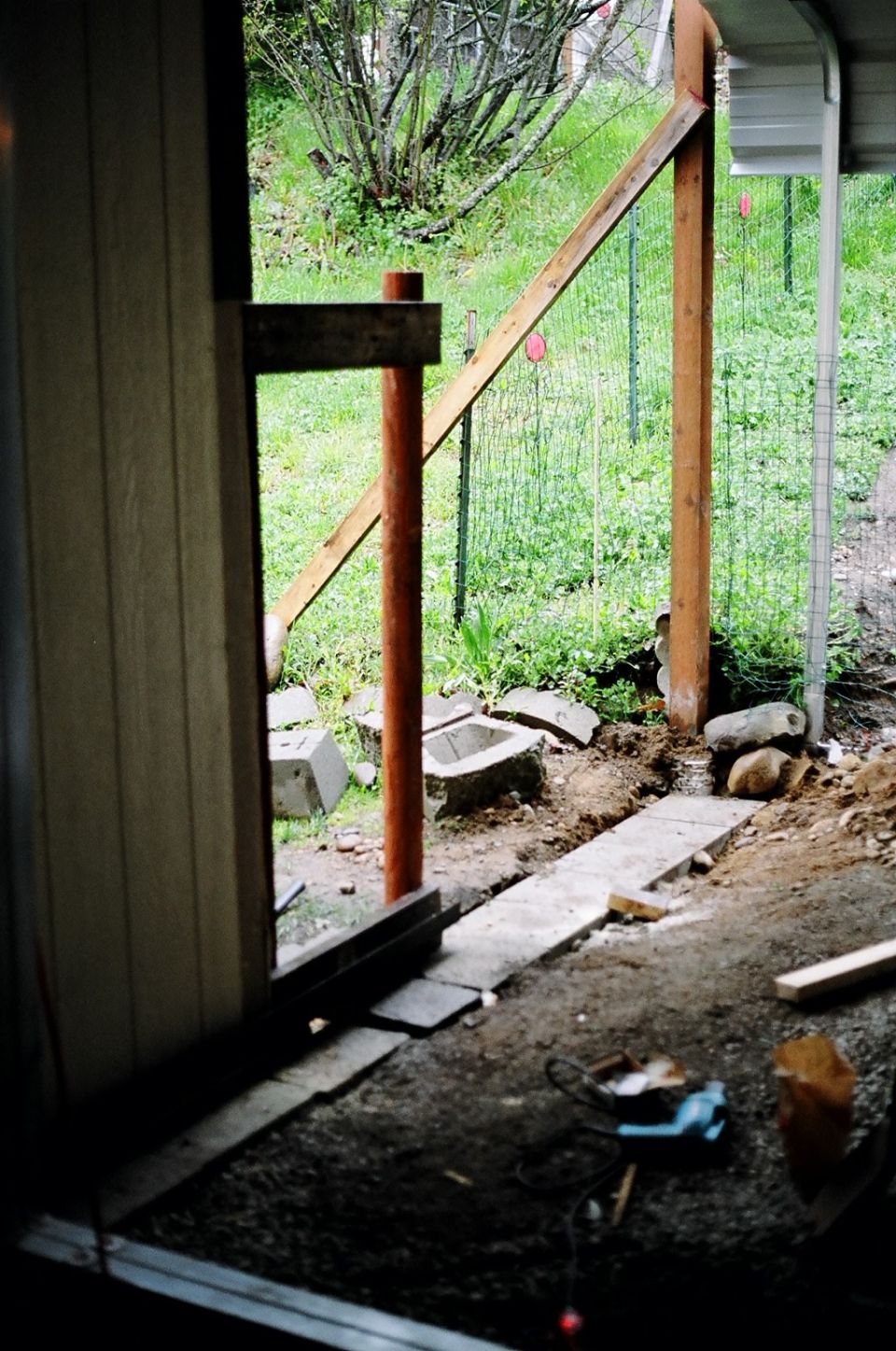 Build the extention of the building to fit the gate size.