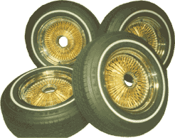 1978 Ford Bronco - A set of four gold wire wheels with whitewall tires are displayed.