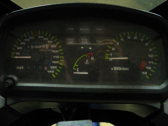 Motorcycle gauge cluster with speedometer, tachometer, and temp gauge