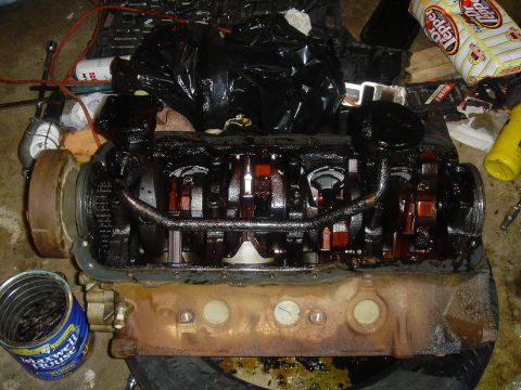 1986 Ford Mustang - Engine block and crankshaft assembly, with a Maxwell House coffee can in the foreground.